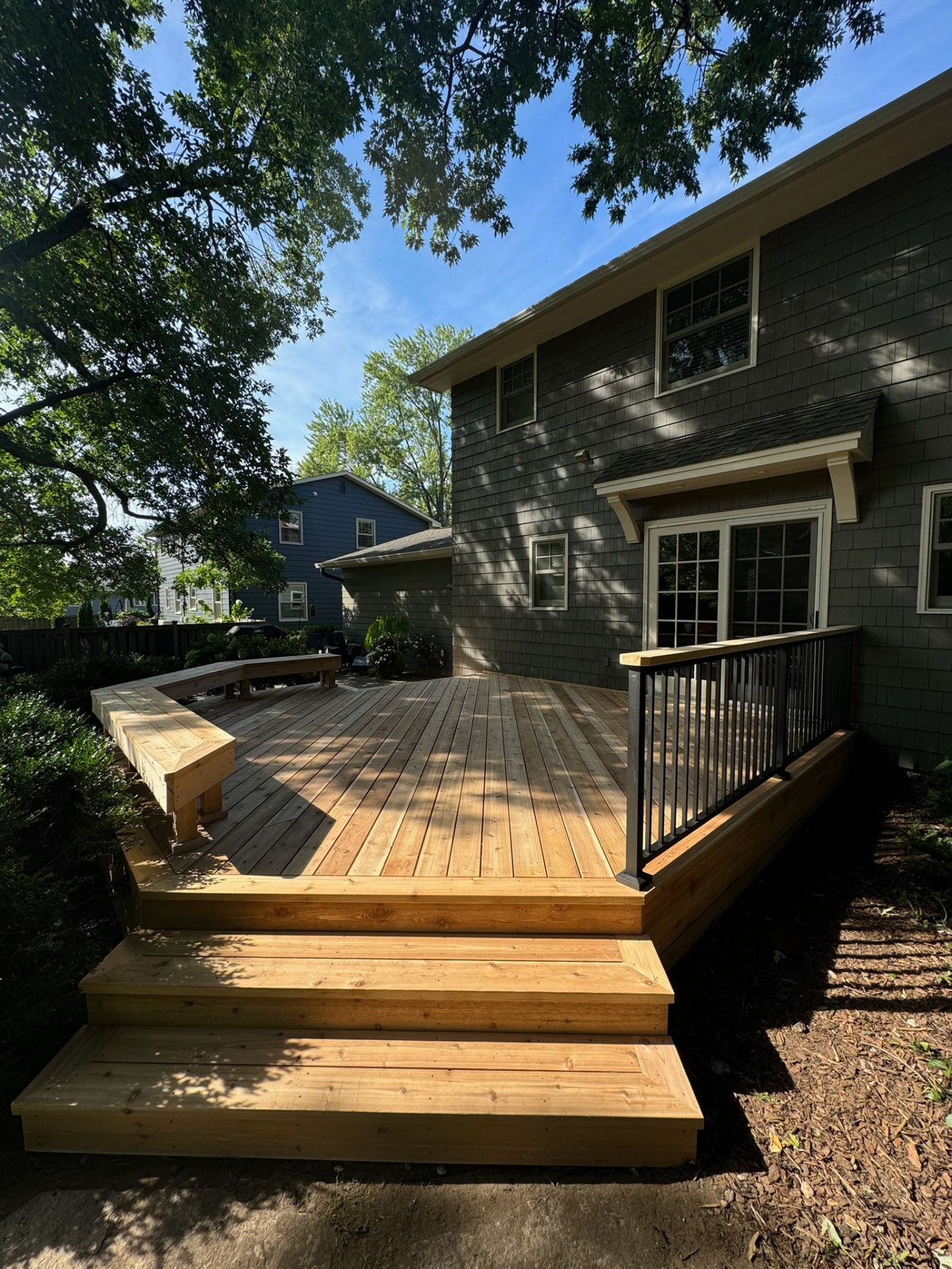 Cedar deck with bench and wide steps